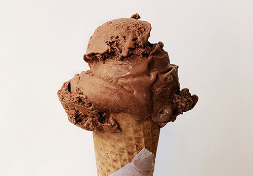 chocolate ice cream on a waffle cone